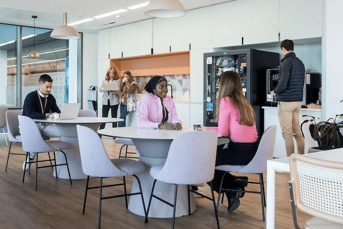 Workplace professionals discussing business refreshment services