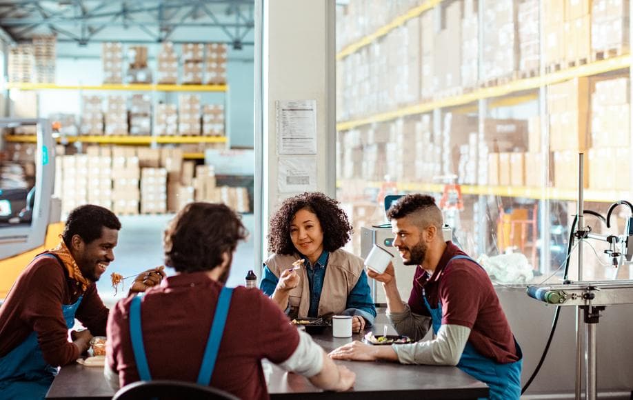 Employees enjoying a break inside a warehouse and manufacturing facility